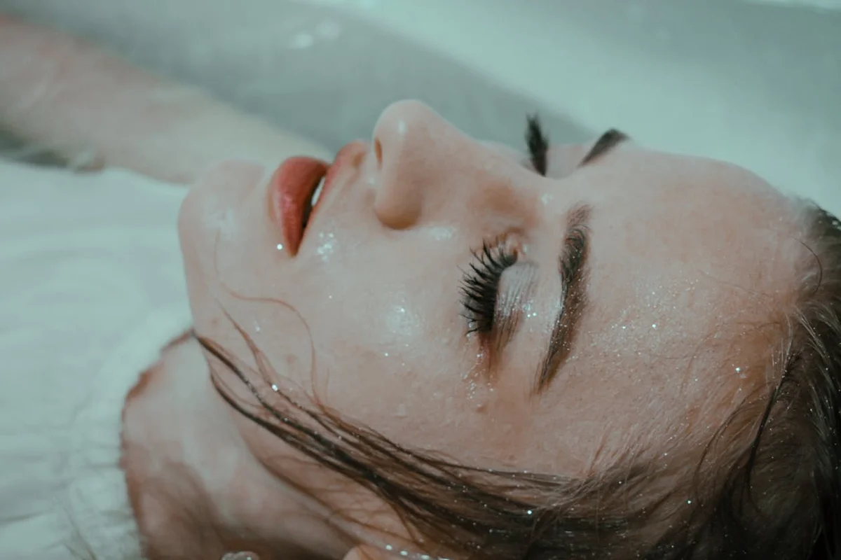 Woman relaxing in bathtub enjoying spa-like bathroom experience